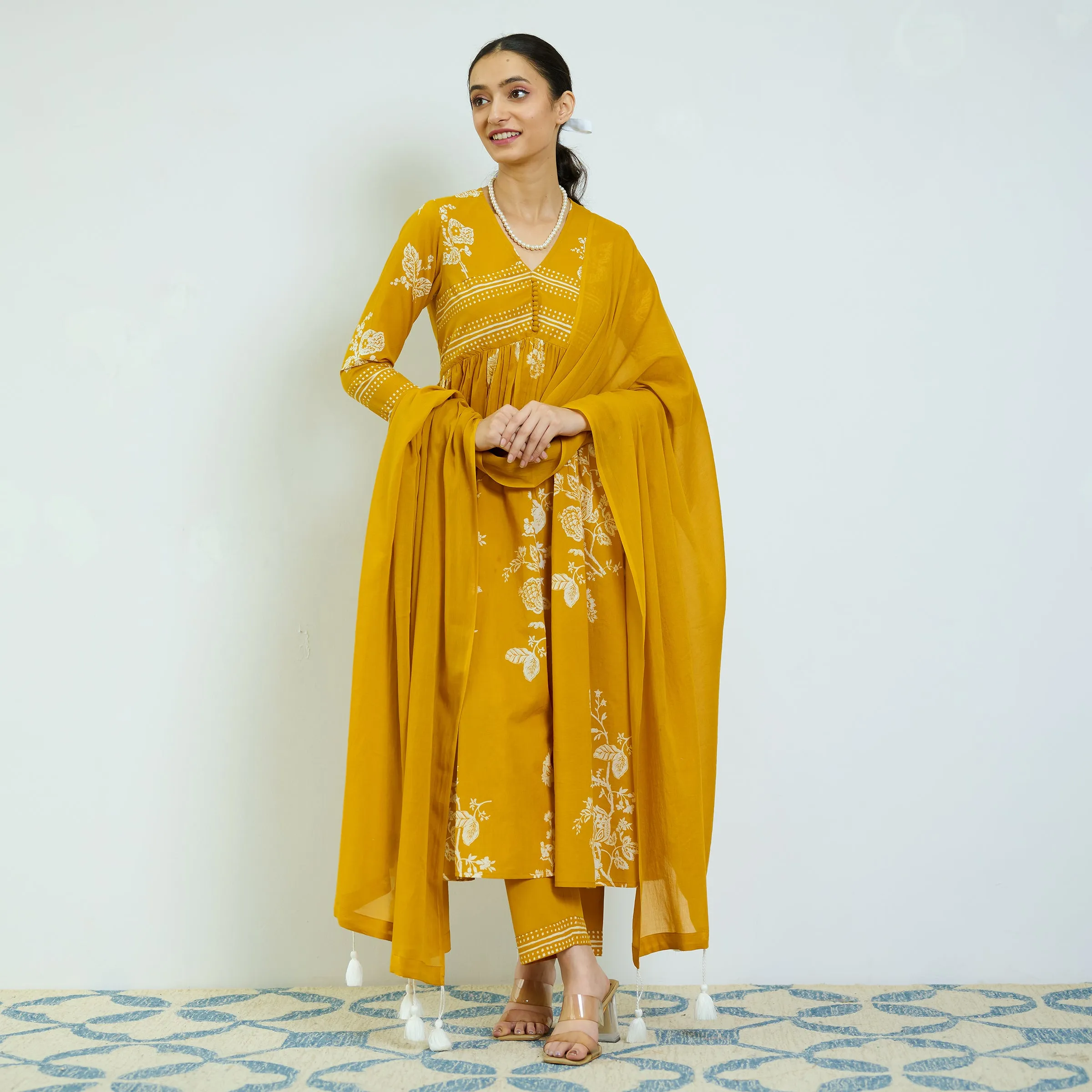 Zehra Yellow Cotton Kurta Set with Mul Cotton Dupatta & Tassel Detail
